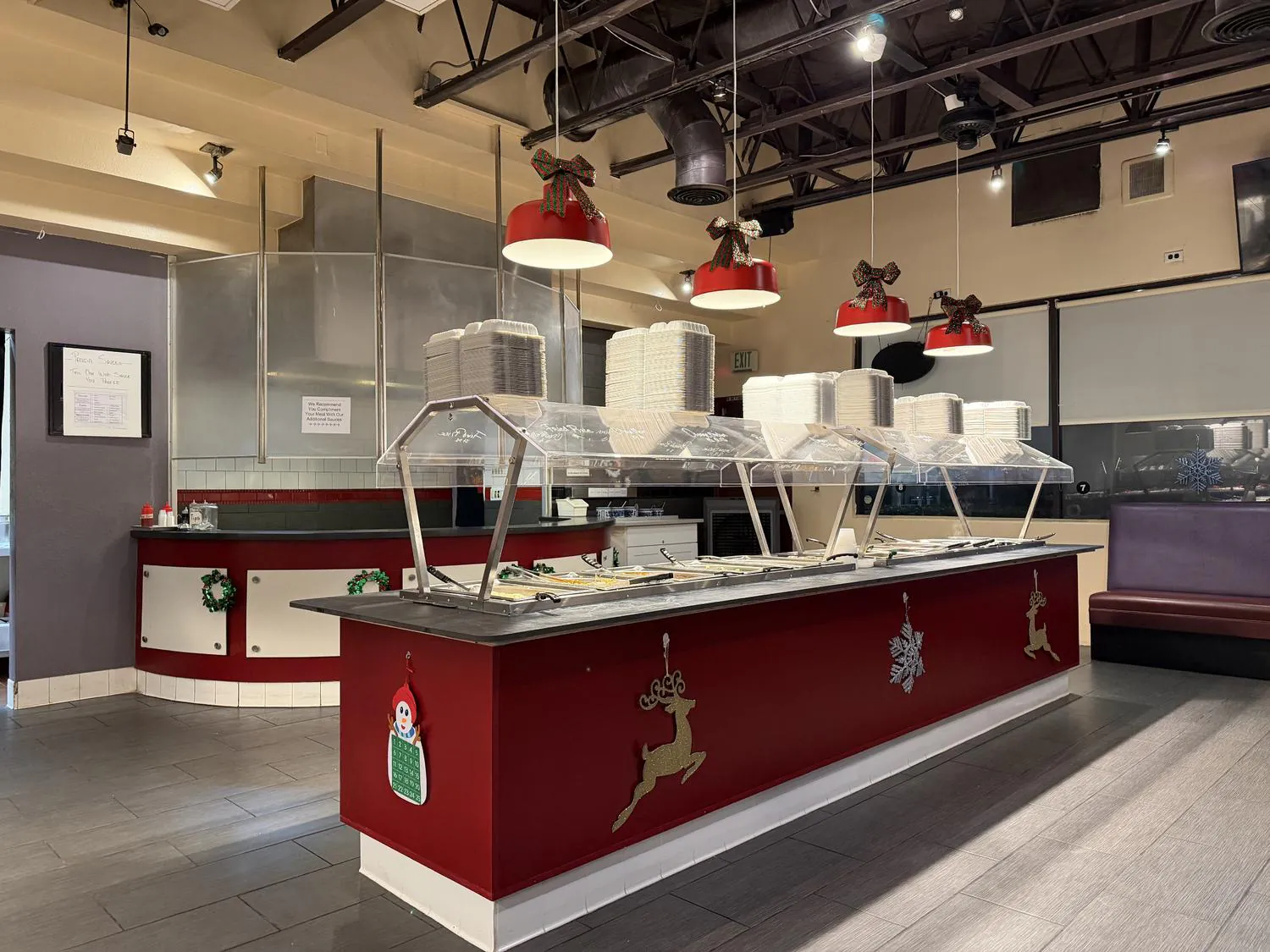 Christmas-decorated food bar with ingredients & plates at Panda Mongolian BBQ, a Chinese Restaurant in Orange