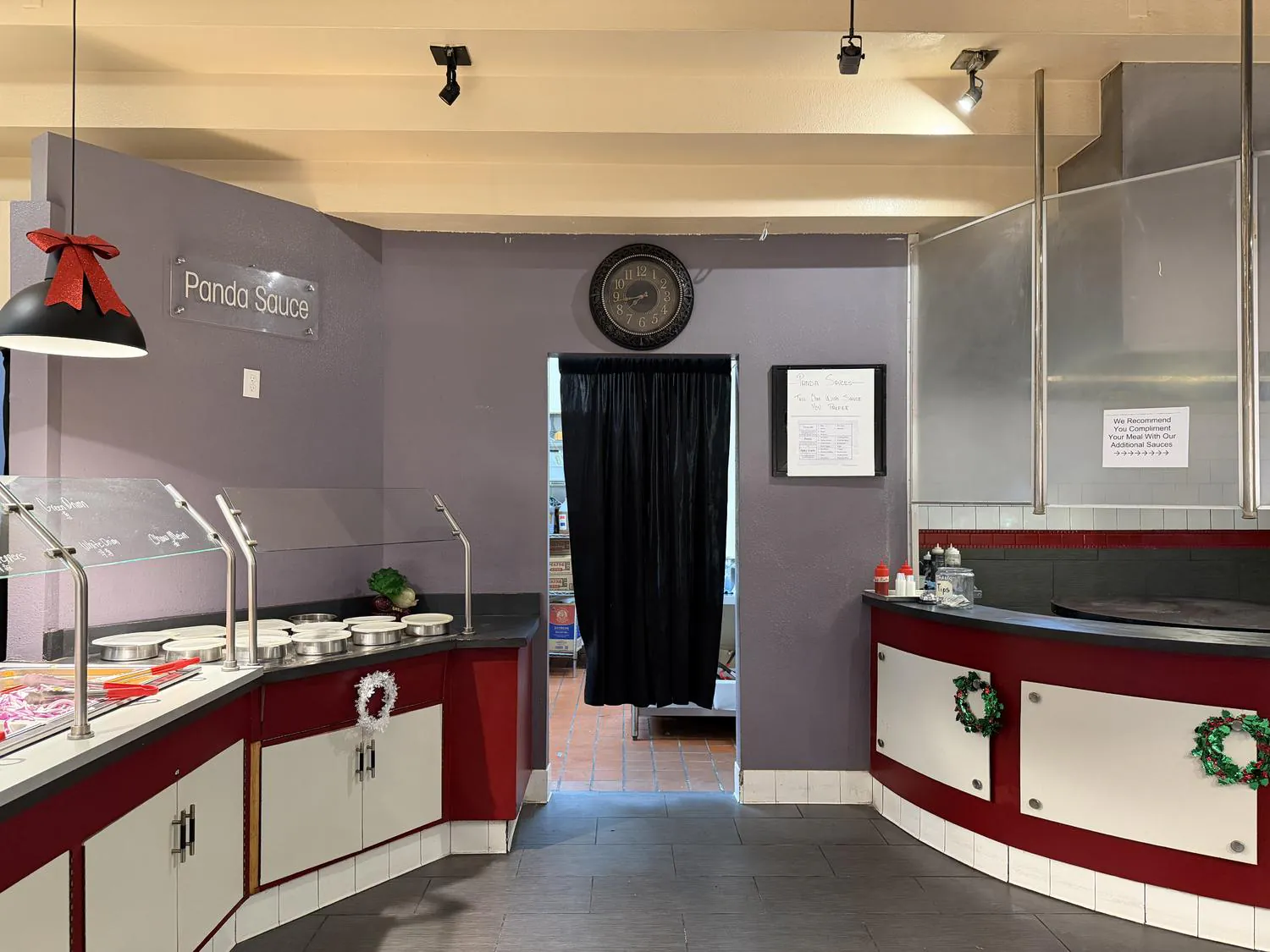 Restaurant interior entrance with sauce station & decor at Panda Mongolian BBQ, a Chinese Restaurant in Orange