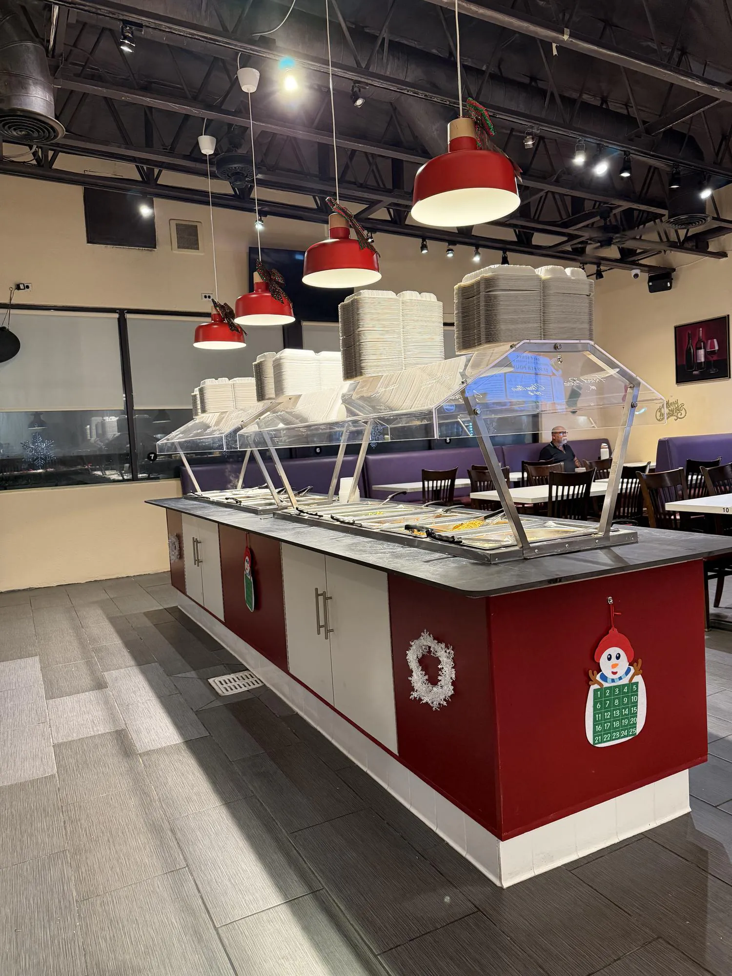 Christmas-decorated serving bar with plates at Panda Mongolian BBQ, a Chinese Restaurant in Orange