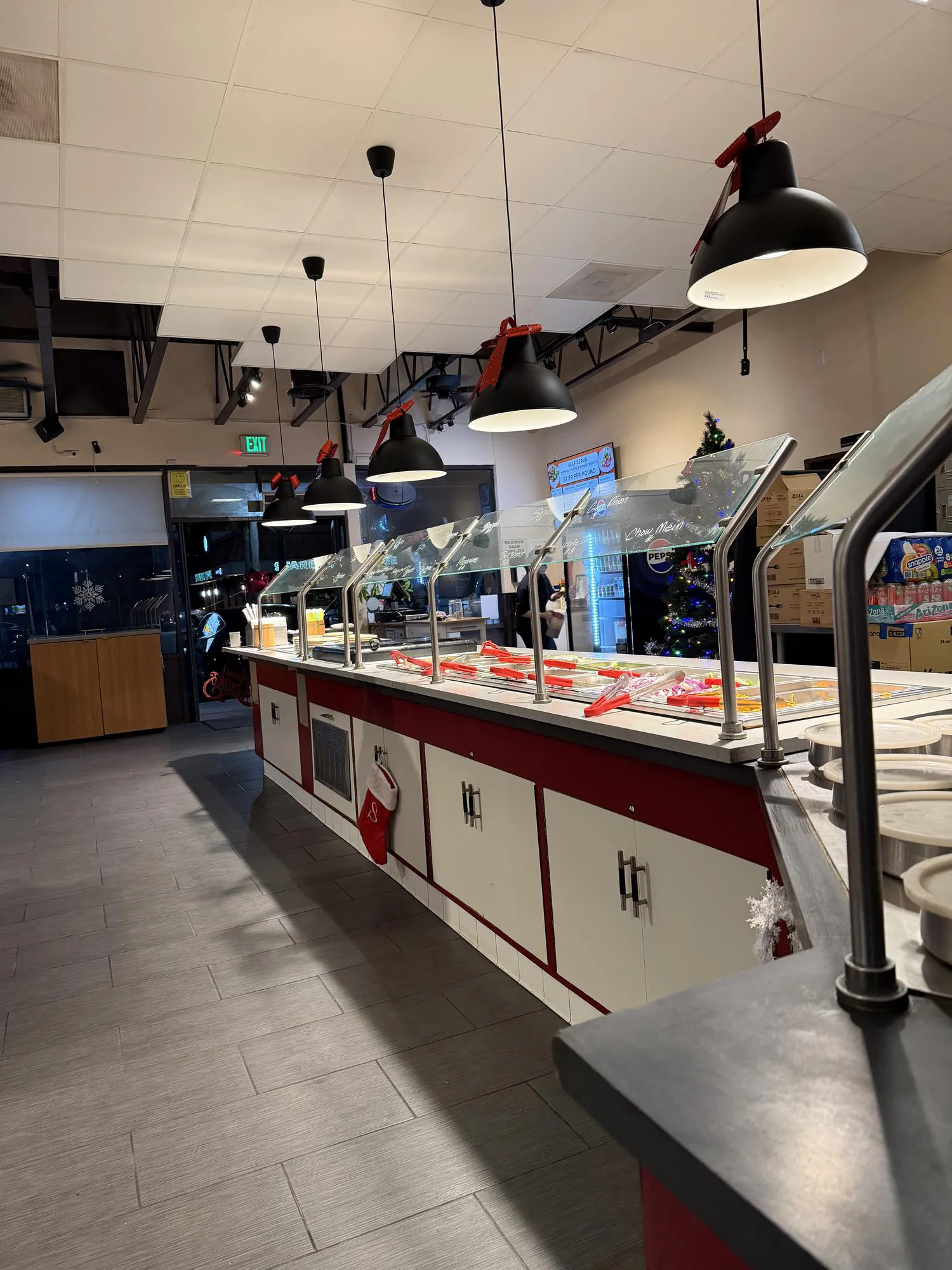 Long ingredient bar with festive decor at Panda Mongolian BBQ, a Chinese Restaurant in Orange
