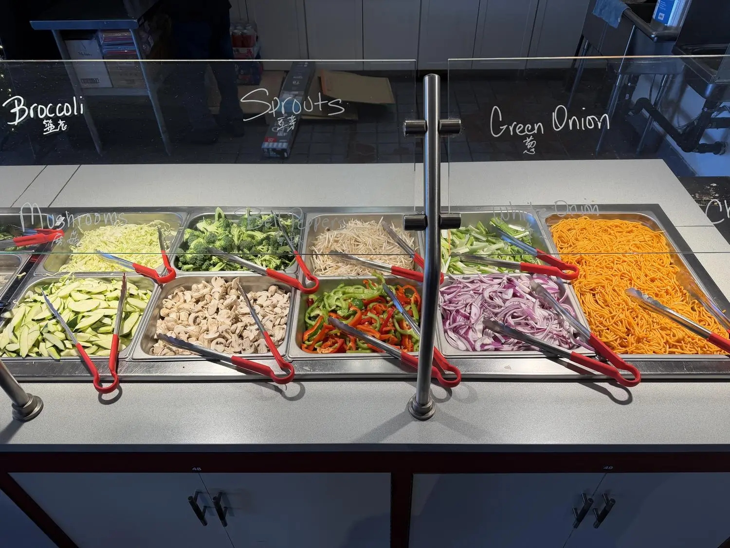 Labeled vegetable ingredient bar (broccoli, sprouts) at Panda Mongolian BBQ, a Chinese Restaurant in Orange