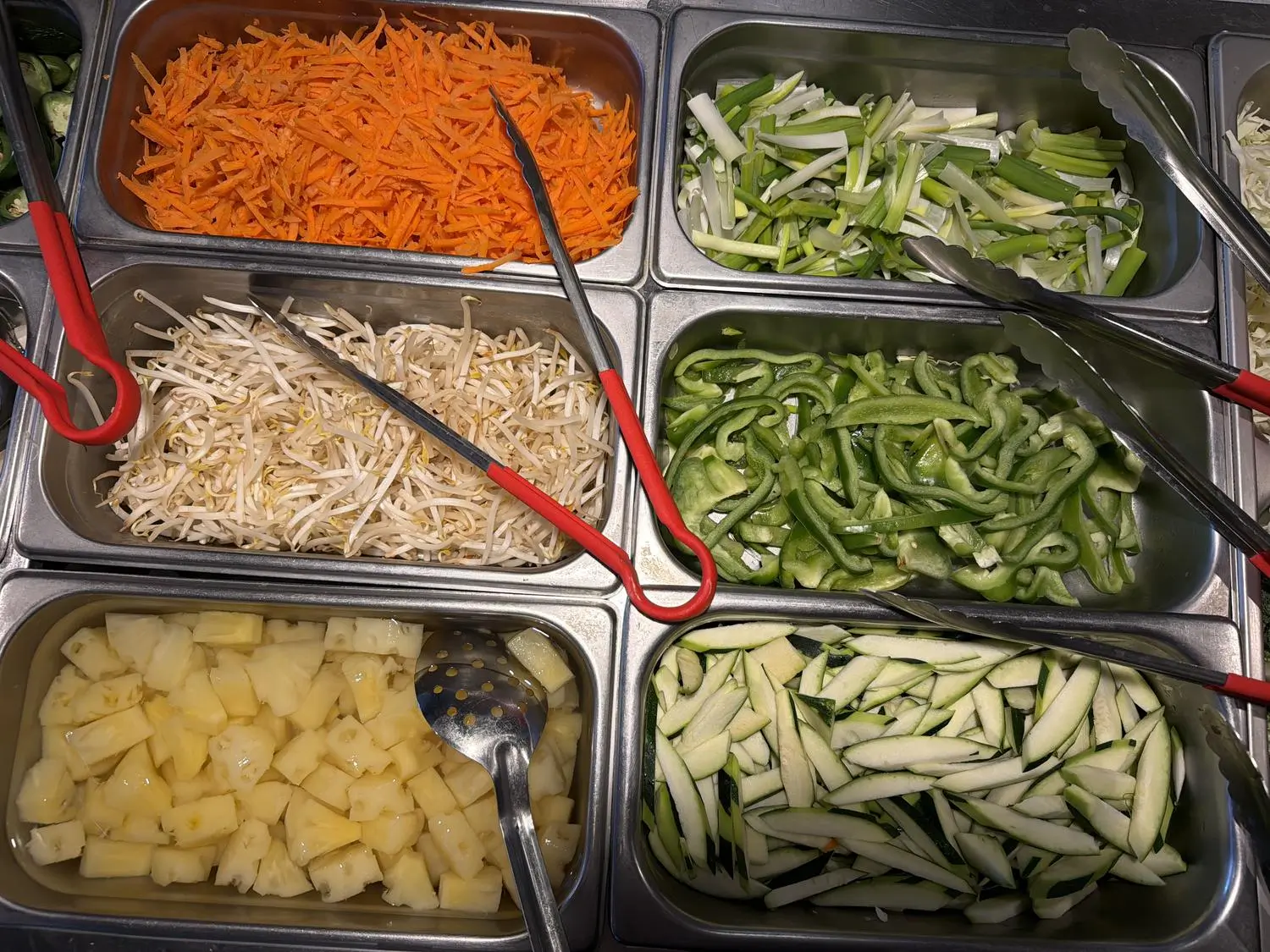 Fresh vegetable assortment (carrots, pineapple) at Panda Mongolian BBQ, a Chinese Restaurant in Orange