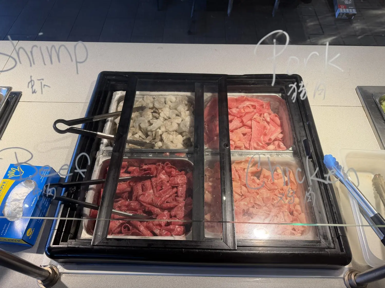 Meat & seafood ingredient bar (shrimp, beef, pork, chicken) at Panda Mongolian BBQ, a Chinese Restaurant in Orange